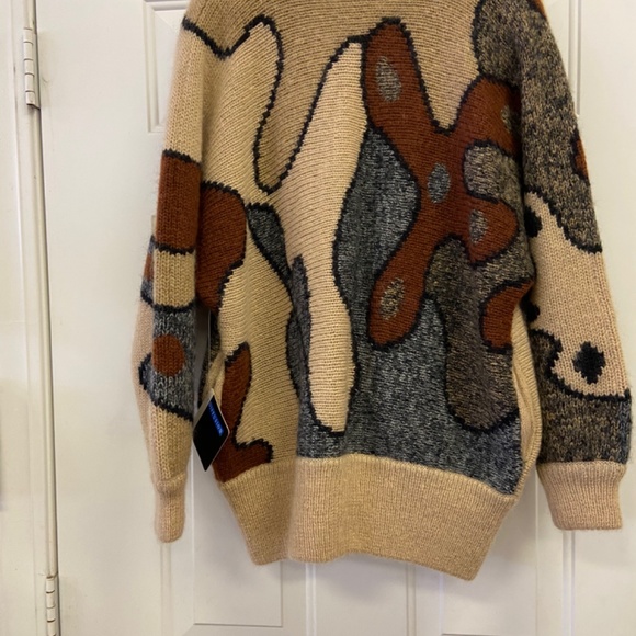 A medium warm wool button up sweater. - Picture 2 of 6